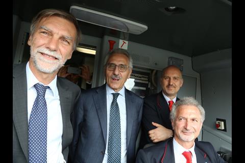 Transport Minister Graziano Delrio (left) and RFI Managing Director Maurizio Gentile (centre) viewed the rebuilt line from the cab. (Photo: David Campione)